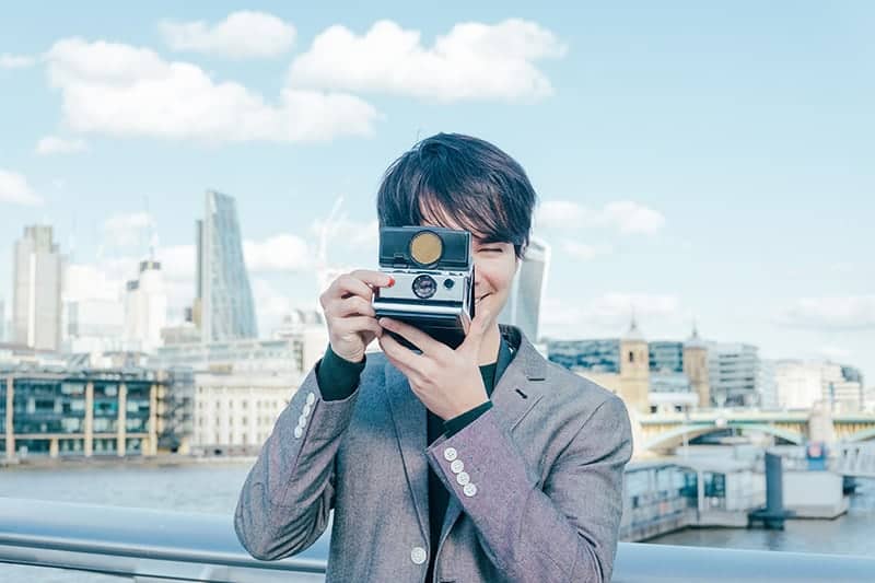 Portrait of London fashion photographer Ira Giorgetti captured on the Millennium Bridge